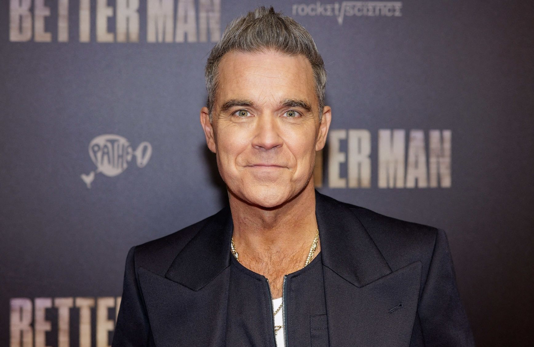 L'évolution Stylistique De Robbie Williams: De Rebelle À Icône